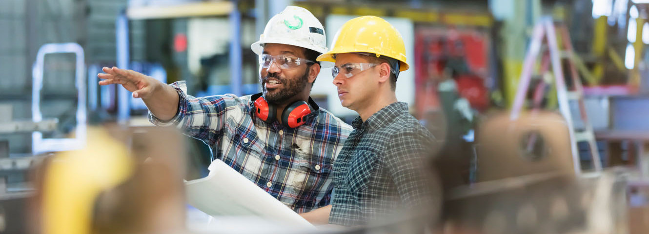 Men in construction hats working